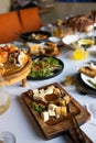 People Celebrating Thanksgiving Day Holiday Traditions Concept. banquet table with tablecloth in restaurant. Royalty Free Stock Photo