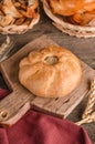 Appetizing fresh culinary pastry - beautiful curly pie with filling on wooden Royalty Free Stock Photo