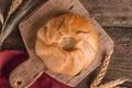 Appetizing fresh culinary pastry - beautiful curly pie with filling on wooden Royalty Free Stock Photo