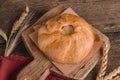 Appetizing fresh culinary pastry - beautiful curly pie with filling on wooden Royalty Free Stock Photo