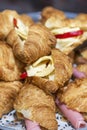 Appetizing fresh sandwich croissants. Business meetings, events and snacks for the holidays. Close-up. Vertical. Selective focus Royalty Free Stock Photo