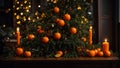 Appetizing fresh tangerines, candles, Christmas tree branch