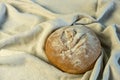 Appetizing freshly baked bread has just been put on the table.