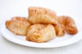 Appetizing freshly prepared turkish baklava on a white plate. View from above. Traditional oriental sweets, goodies. Isolated