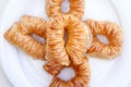 Appetizing freshly prepared turkish baklava on a white plate. View from above. Traditional oriental sweets, goodies. Isolated