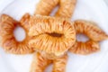 Appetizing freshly prepared turkish baklava on a white plate. View from above. Traditional oriental sweets, goodies. Isolated