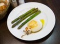 Fried sepia with baked asparagus