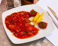 Tilapia with vegetable stew, french fries and sun-dried tomato Royalty Free Stock Photo