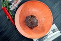 Appetizing grilled aged ribeye beef steak served in a plate on a wooden, black background. American BBQ culture