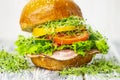 Appetizing hamburger with lard and meat, yellow pepper