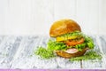 Appetizing hamburger with lard and meat, yellow pepper