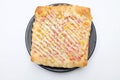 Appetizing Homemade pizza bread with ketchup, mayonnaise, boiled corn sausage and cheese in the black plate Royalty Free Stock Photo