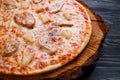 Appetizing italian food. Hot baked pizza with chicken and pine Royalty Free Stock Photo