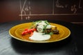 Appetizing juicy meat with fried champignons with garlic sauce and grilled vegetables on the table in a cafe. Delicious hot Royalty Free Stock Photo