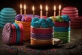 appetizing multi-colored confection with candles for festive birthday party