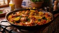 appetizing paella with shrimps and lemon slices, traditional Valencian cuisine