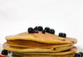 Pancake with black currant and liquid honey