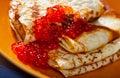 Appetizing pancakes with caviar. Russian kitchen