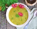 Appetizing pea soup with bacon and sausage Royalty Free Stock Photo