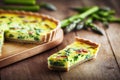 Appetizing pieces of asparagus tart with light yellow filling with greens