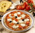 Appetizing pizza mozzarella and fresh tomatoes