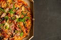 Appetizing pizza with smoked sausages bacon meat tomato cheese arugula Royalty Free Stock Photo