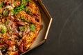 Appetizing pizza with smoked sausages bacon meat tomato cheese arugula Royalty Free Stock Photo