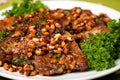 Appetizing pork chop with cedar nutlets Royalty Free Stock Photo