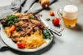 Appetizing pork knuckle with with sauerkraut and beer. Oktoberfest meal. Traditional dish in German cuisine schweinshaxe Royalty Free Stock Photo