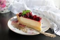 Appetizing portioned piece of cottage cheese tart and cherries on a porcelain plate. Tea party, morning, five o Royalty Free Stock Photo