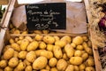 Crate of potatoes close-up on a market stall Royalty Free Stock Photo