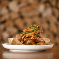 Appetizing roasted or fried chicken wings sesame seeds and onion. Soft focus. Food concept. Square format or 1x1 for