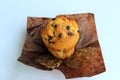 Appetizing, ruddy, tasty vanilla muffin with chocolate pieces