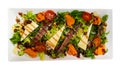 Salad of lettuce with tomatoes, cheese, anchovies and romesco salsa Royalty Free Stock Photo