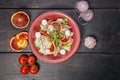 Appetizing salad with salted trout, red oranges, sweet onions and mozzarella cheese. Delicious Mediterranean cuisine. Top view. Royalty Free Stock Photo