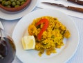 Appetizing seafood dish Paella with shrimp.