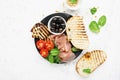 Appetizing snack with fried cheese haloumi, olives, bruschetta, tomatoes, olives, pine nuts, olive oil, honey and Royalty Free Stock Photo