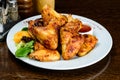 Appetizing spicy baked chicken wings with sweet chili sauce on t Royalty Free Stock Photo