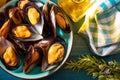 Appetizing steamed mussels olive oil, lemon and rosemary. Mediterranean diet style. Top View