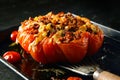 Appetizing stuffed oven roasted ripe tomato