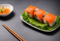 appetizing sushi rolls and salmon fillets
