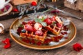 Dessert Belgian waffles with berries and sauce