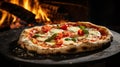 appetizing and tasty typical Italian pizza with mozzarella, cherry tomatoes and basil cooked in a wood oven in the background Royalty Free Stock Photo