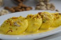 Appetizing traditional Ras malai Indian sweet dish soft paneer balls immersed in creamy milk