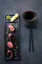 Appetizing tuna gunkan sushi set on black plate Royalty Free Stock Photo