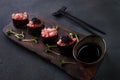 Appetizing tuna gunkan sushi set on black plate Royalty Free Stock Photo