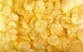 Appetizing yellow potato chips background Royalty Free Stock Photo