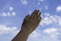 Applause. Kid hands applauding over blue sky background. Low angle view