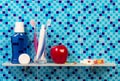 Apple and accessories for oral hygiene on bathroom