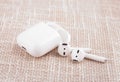 Apple air pods on beige background Royalty Free Stock Photo